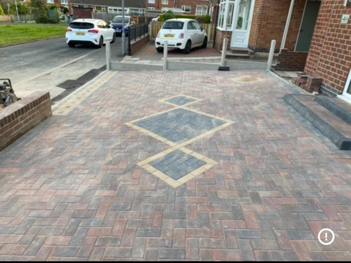 Block paved driveway with a feature border