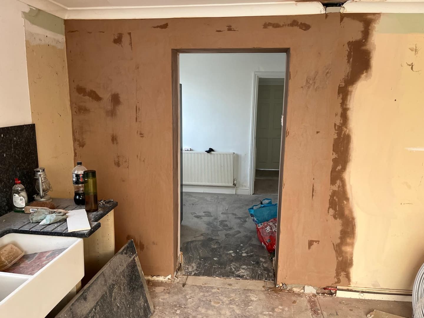 Kitchen stripped back, during