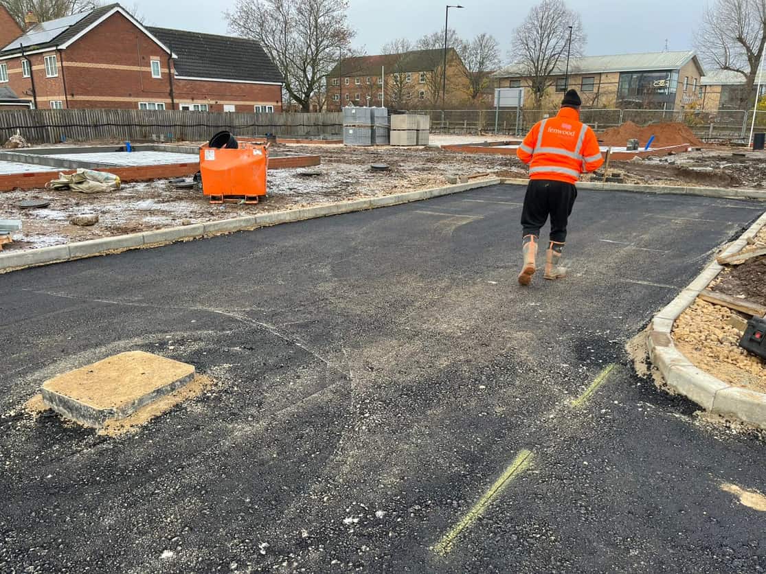 Car park surfaced, kerbed and marked out
